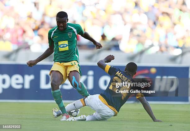 Thamsanqa Gabuza is tackled by Tsepo Masilela during the Absa Premiership match between Golden Arrows and Kaizer Chiefs at Moses Mabhida Stadium on...