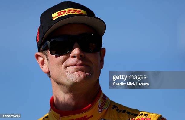 Ryan Hunter-Reay, driver of the Andretti Autosport DHL Chevrolet, stands on pit road after practice for the Honda Indy Grand Prix of Alabama at...