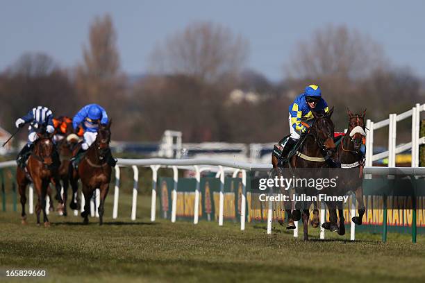 Auroras Encore ridden by Ryan Mania on their way to winning the John Smiths Grand National at Aintree Racecourse on April 6, 2013 in Liverpool,...