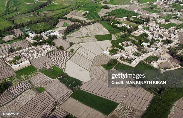 An aerial view of the fields and a village on the outskirts of in the city of Jalalabad situated in province of Nangarhar on April 5, 2013. An...