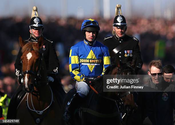 Auroras Encore ridden by Ryan Mania after winning the John Smiths Grand National at Aintree Racecourse on April 6, 2013 in Liverpool, England.