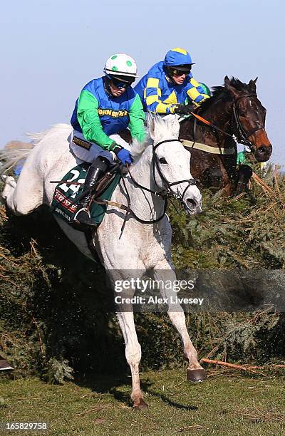 Ryan Mania riding Auroras Encore jump the chair behind Conor O'Farrell riding Swing Bill during the John Smiths Grand National Steeple Chase at...