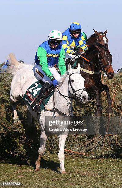 Ryan Mania riding Auroras Encore jump the chair behind Conor O'Farrell riding Swing Bill during the John Smiths Grand National Steeple Chase at...