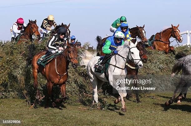 Ryan Mania riding Auroras Encore jump the chair behind Conor O'Farrell riding Swing Bill during the John Smiths Grand National Steeple Chase at...