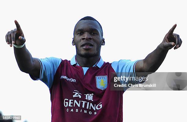 Christian Benteke of Aston Villa celebrates scoring his team's third goal to make the score 1-3 during the Barclays Premier League match between...