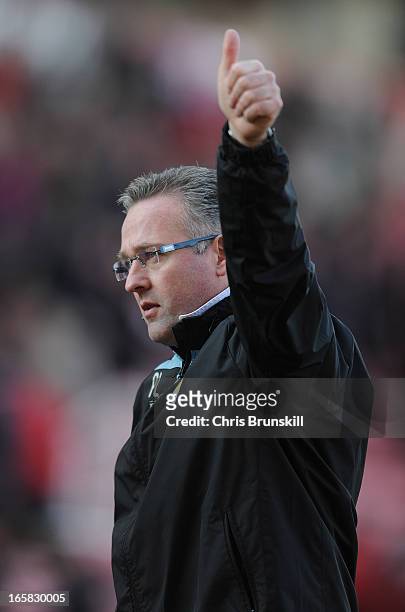 Aston Villa Manager Paul Lambert gives a thumbs up to the fans at the end of the Barclays Premier League match between Stoke City and Aston Villa at...