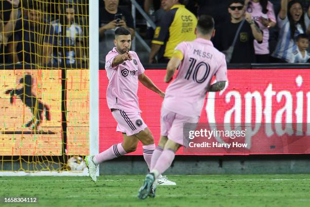 Jordi Alba of Inter Miami CF celebrates with Lionel Messi after scoring a goal in the second half during a match between Inter Miami CF and Los...