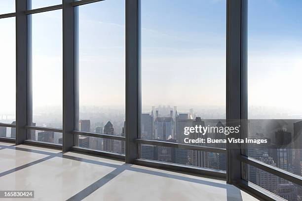 empty office overlooking a city - office skyscraper stock pictures, royalty-free photos & images