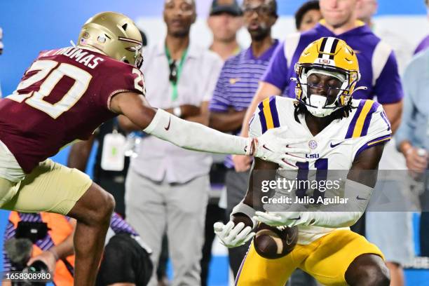 Azareye'h Thomas of the Florida State Seminoles breaks up a pass intended for Brian Thomas Jr. #11 of the LSU Tigers in the third quarter at Camping...