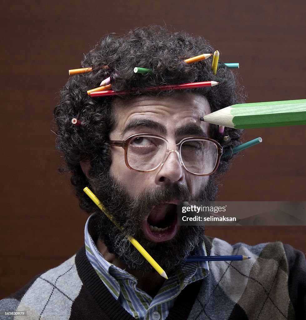 Busy teacher confronting flying pencils