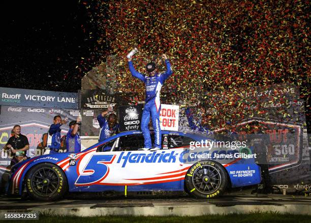 Kyle Larson, driver of the HendrickCars.com Chevrolet, celebrates in victory lane after winning the NASCAR Cup Series Cook Out Southern 500 at...