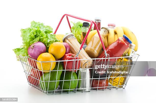 o cesto de compras cheio de mercearia e produtos hortícolas - goes to the basket imagens e fotografias de stock