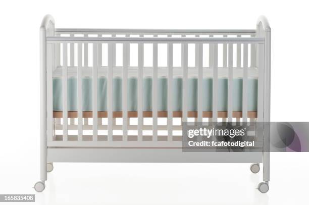 white baby crib on white background - baby crib stock pictures, royalty-free photos & images