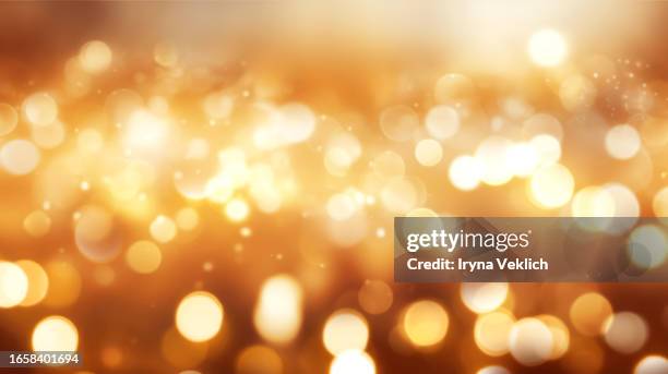 sparkling background with bokeh made of elegant gold yellow christmas lights. - christmas bokeh ストックフォトと画像