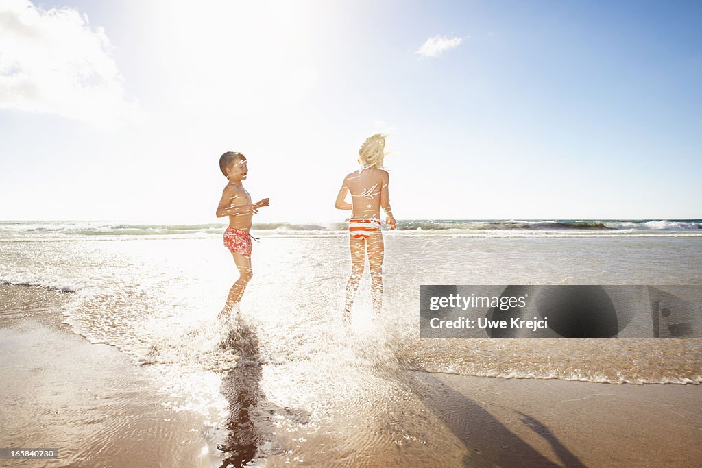 Children playing in sea