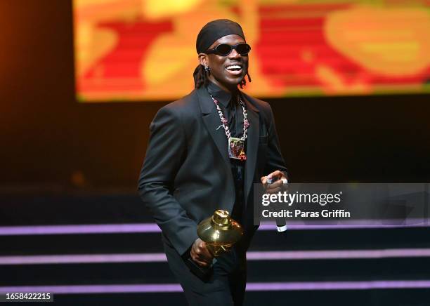 Recording artist Rema accepts the Best Male Artiste award during The 16th Headies Awards at Cobb Energy Performing Arts Centre on September 03, 2023...