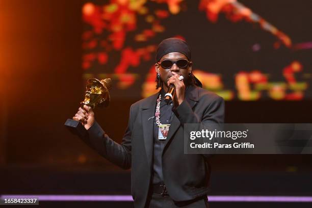 Recording artist Rema accepts the Best Male Artiste award during The 16th Headies Awards at Cobb Energy Performing Arts Centre on September 03, 2023...