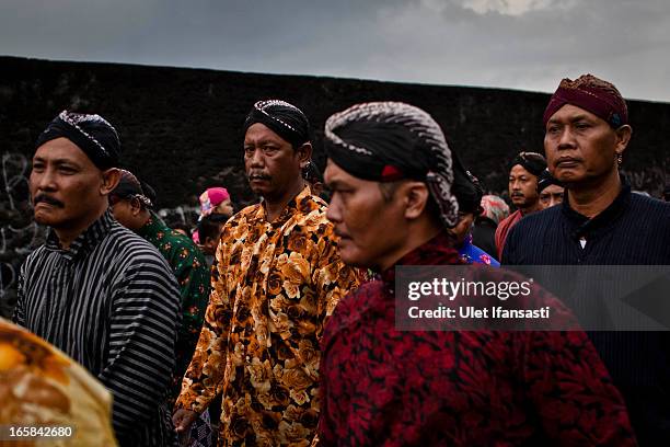 Javanese men wearing traditional costume during the Cembengan ritual 'Manten Tebu' on April 6, 2013 in Yogyakarta, Indonesia. The Cembengan ritual,...