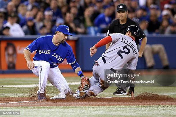 Jacoby Ellsbury of the Boston Red Sox steals third base in the first inning during MLB game action as Mark DeRosa of the Toronto Blue Jays applies...