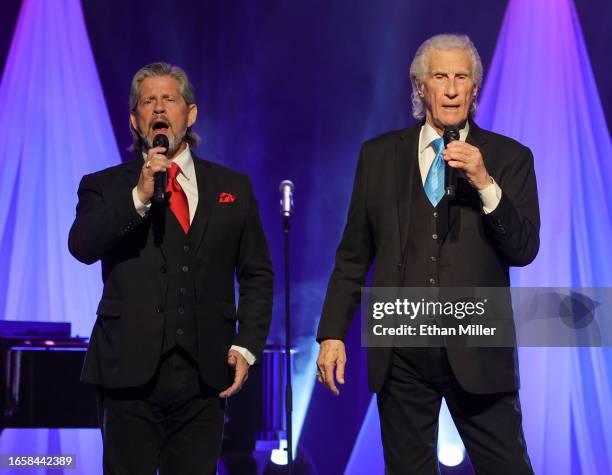 Singers Bucky Heard and Bill Medley of The Righteous Brothers perform during the production "Las Vegas Will You Marry Me" before a wedding vow...