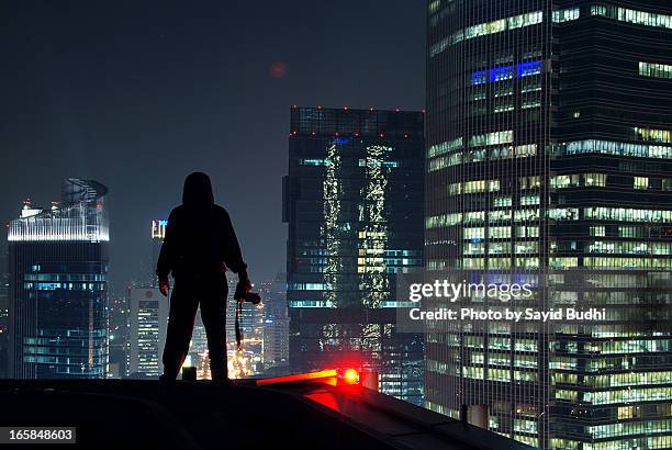 Standing on the Roof Top of a Building