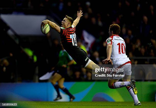 Wing Chris Ashton of Saracens outpaces Paddy Jackson of Ulster to score his team's second try during the Heineken Cup quarter final match between...