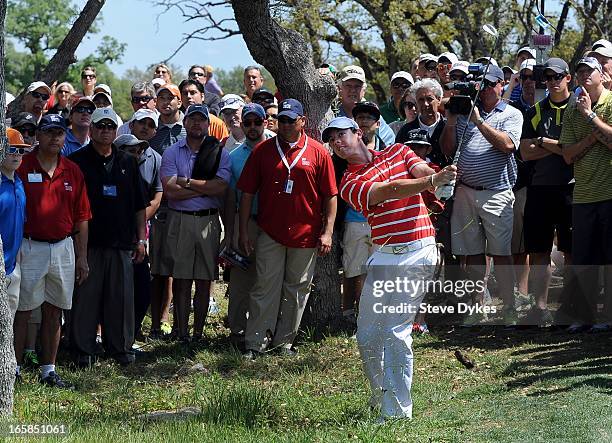 Rory McIlroy of Ireland chips out of the rough on the 5th hole during the third round of the Valero Texas Open at the AT&T Oaks Course at TPC San...