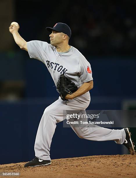 Alfredo Aceves of the Boston Red Sox delivers a pitch during MLB game action against the Toronto Blue Jays on April 6, 2013 at Rogers Centre in...