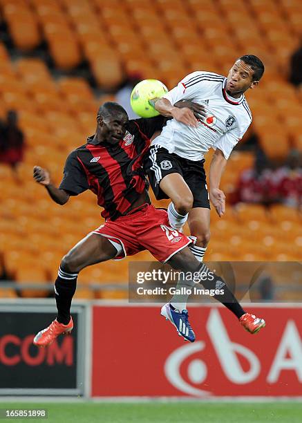 Daine Klate of Orlando pirates battling for the ball with Mwelwa Sakala of Zanaco FC during the CAF Confedaration Cup match between Orlando Pirates...