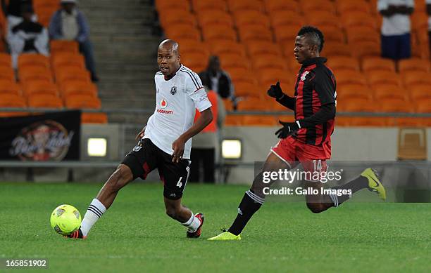 Happy Jele of Pirates dribbling past Dodrick Kwabe of Zanaco FC during the CAF Confedaration Cup match between Orlando Pirates and Zanaco at FNB...