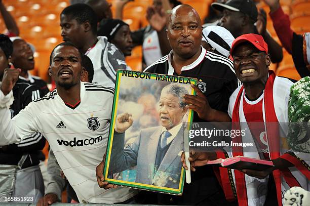 Orlando Pirates supporters carrying a poster of Nelson Mandela during the CAF Confedaration Cup match between Orlando Pirates and Zanaco at FNB...