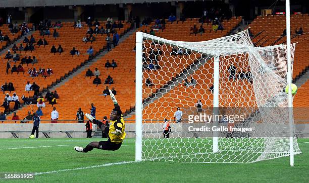 Racha Kola of Zanaco FC is beaten by a powerful shot from Mpho Makola of Pirates during the CAF Confedaration Cup match between Orlando Pirates and...