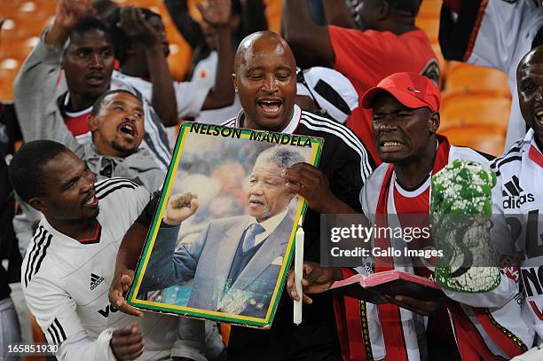 Orlando Pirates supporters carrying a poster of Nelson Mandela during the CAF Confedaration Cup match between Orlando Pirates and Zanaco at FNB...