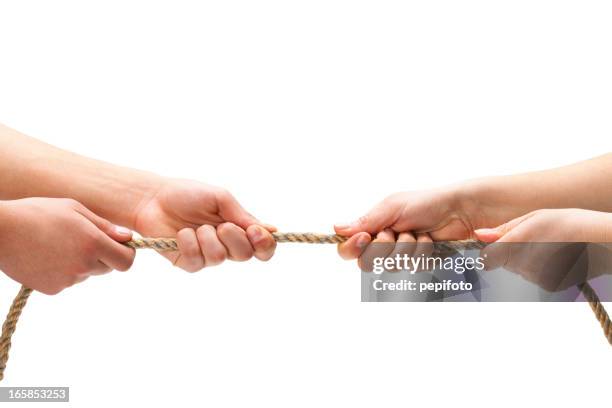 tug of war - tug of war stock pictures, royalty-free photos & images