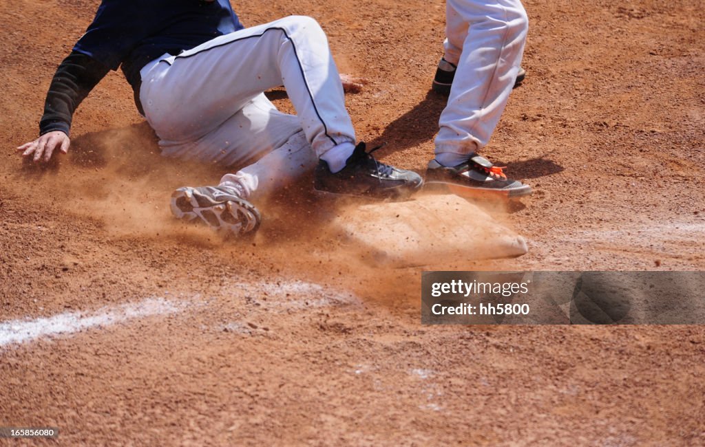 Baseball Player running  sliding Into Base