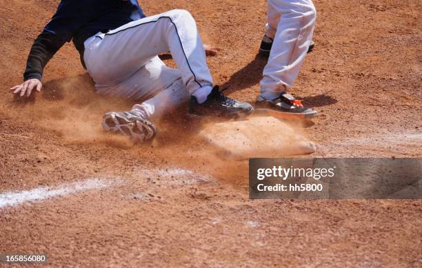 baseball player running  sliding into base - youth sports league stock pictures, royalty-free photos & images