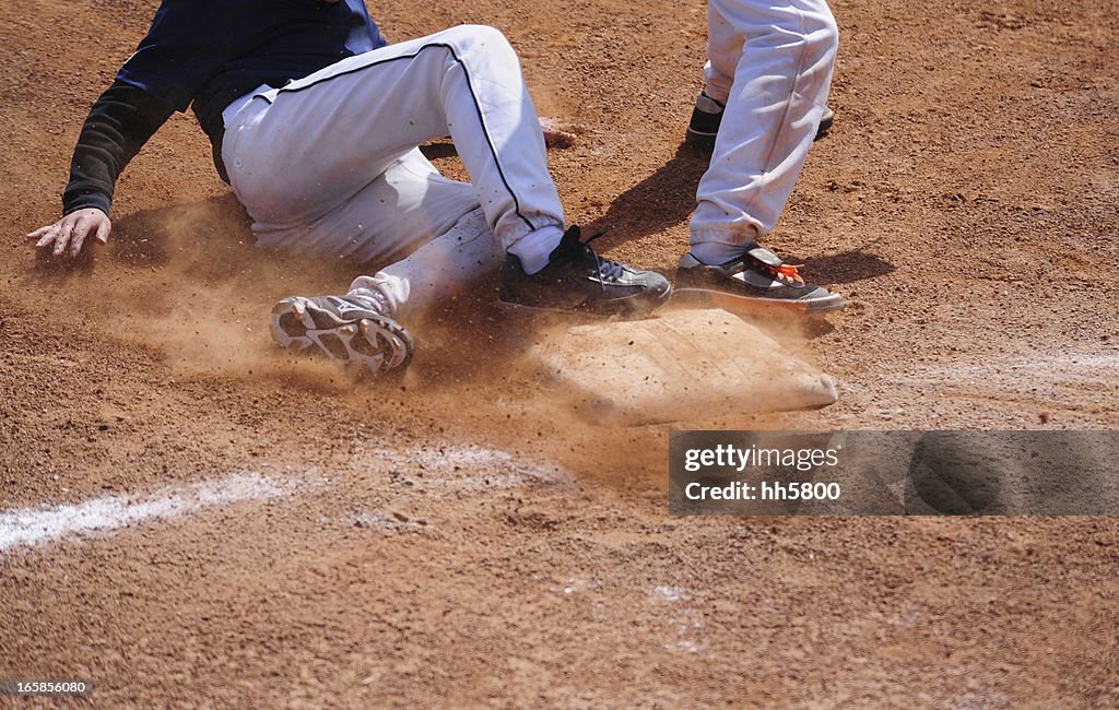 Baseball Player running  sliding Into Base