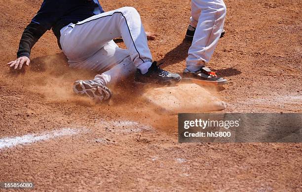 baseball player running  sliding into base - base sports equipment 個照片及圖片檔