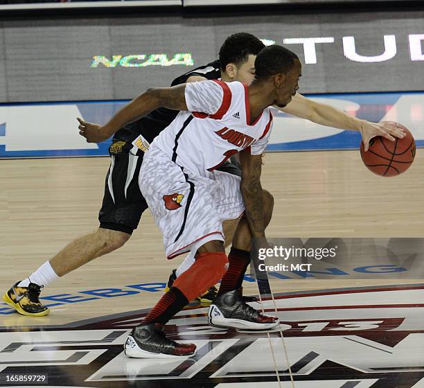 Wichita State guard Fred VanVleet battles Louisville guard Russ Smith for a loose ball in the first half of a semi-final matchup in the NCAA Men's...