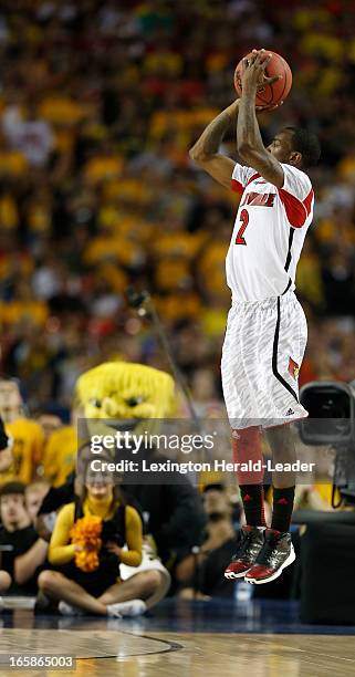 Louisville guard Russ Smith puts up a three-point shot against Wichita State in first half of the NCAA Men's Basketball Championship at the Georgia...