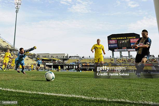 Jack McInerney of Philadelphia Union kicks in the ball for a goal past goalkeeper Andy Gruenebaum of the Columbus Crew in the first half on April 6,...