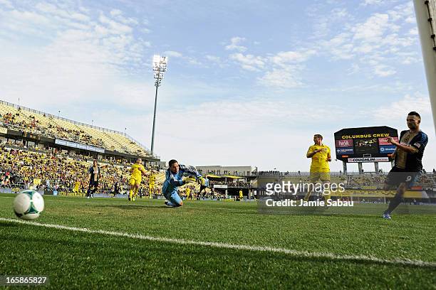 Jack McInerney of Philadelphia Union kicks in the ball for a goal past goalkeeper Andy Gruenebaum of the Columbus Crew in the first half on April 6,...