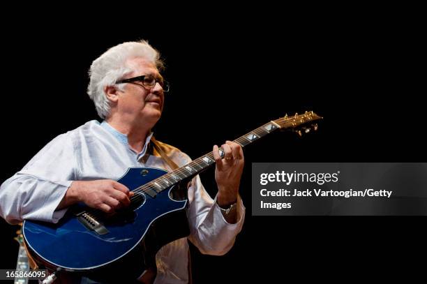 American jazz musician Larry Coryell plays guitar as he leads his band, Bombay Jazz, at a World Music Institute concert at New York University's...