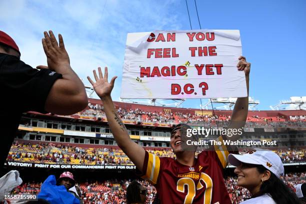 Washington Commanders fan Logan Edwards celebrates after the game against the Arizona Cardinals at FedEx Field on September 10, 2023.