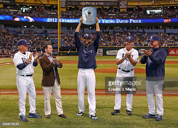 Manager Joe Maddon, General Manager Andrew Friedman, Pitcher David Price, Pitching coach Jim Hickey and Bullpen coach Stan Boroski of the Tampa Bay...