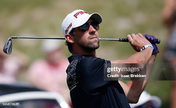 Olympic Gold Medalist Michael Phelps hits a tee shot during ARIA Resort & Casino's Michael Jordan Celebrity Invitational golf tournament at Shadow...