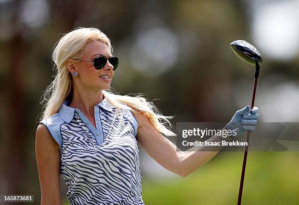 Television personality Win McMurry hits a tee shot during ARIA Resort & Casino's Michael Jordan Celebrity Invitational golf tournament at Shadow...