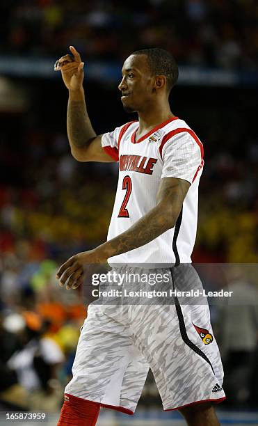 Louisville guard Russ Smith walks off the floor after Louisville defeated Wichita State 72-68 in a semi-final matchup in the NCAA Men's Basketball...