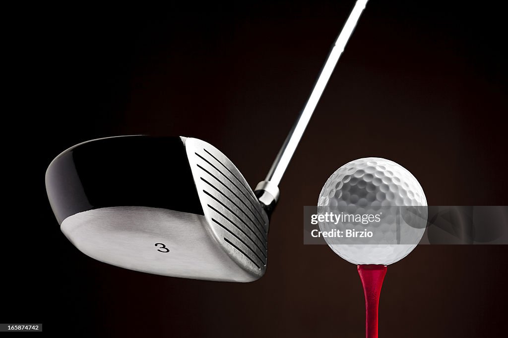 Golf Clubhead hitting a Ball on the Tee