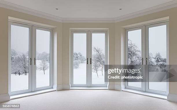 large bay windows and winter view - bay window interior stock pictures, royalty-free photos & images